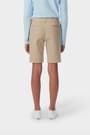 Girl wearing khaki French Toast twill Bermuda short, back shot showcasing welted back pockets and waistband with belt loops. of  Girls' Stretch Twill Bermuda Short opens large image - 4 of 4